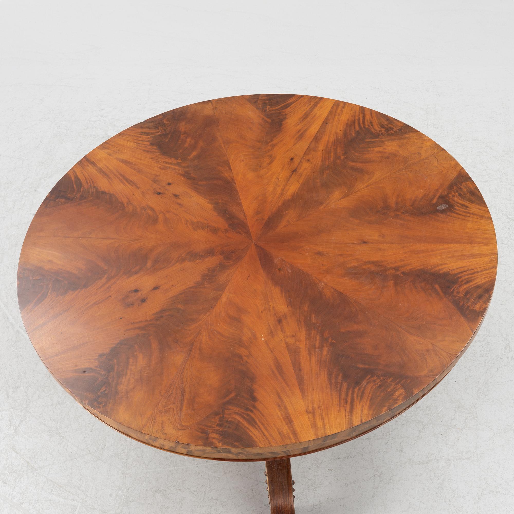 A mahogany salon table, around the mid-19th Century.