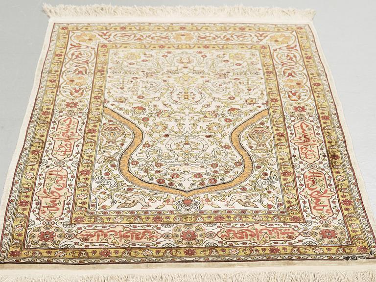 A silk Hereke possibly, around 96 x 66 cm.