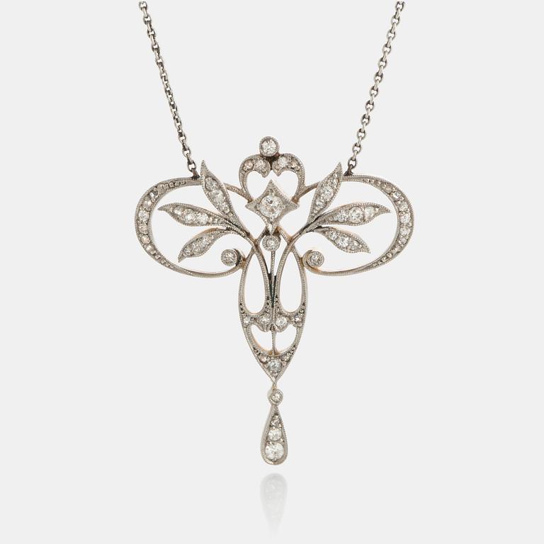 A pendant in platinum and 14K gold set with old- and rose-cut diamonds.