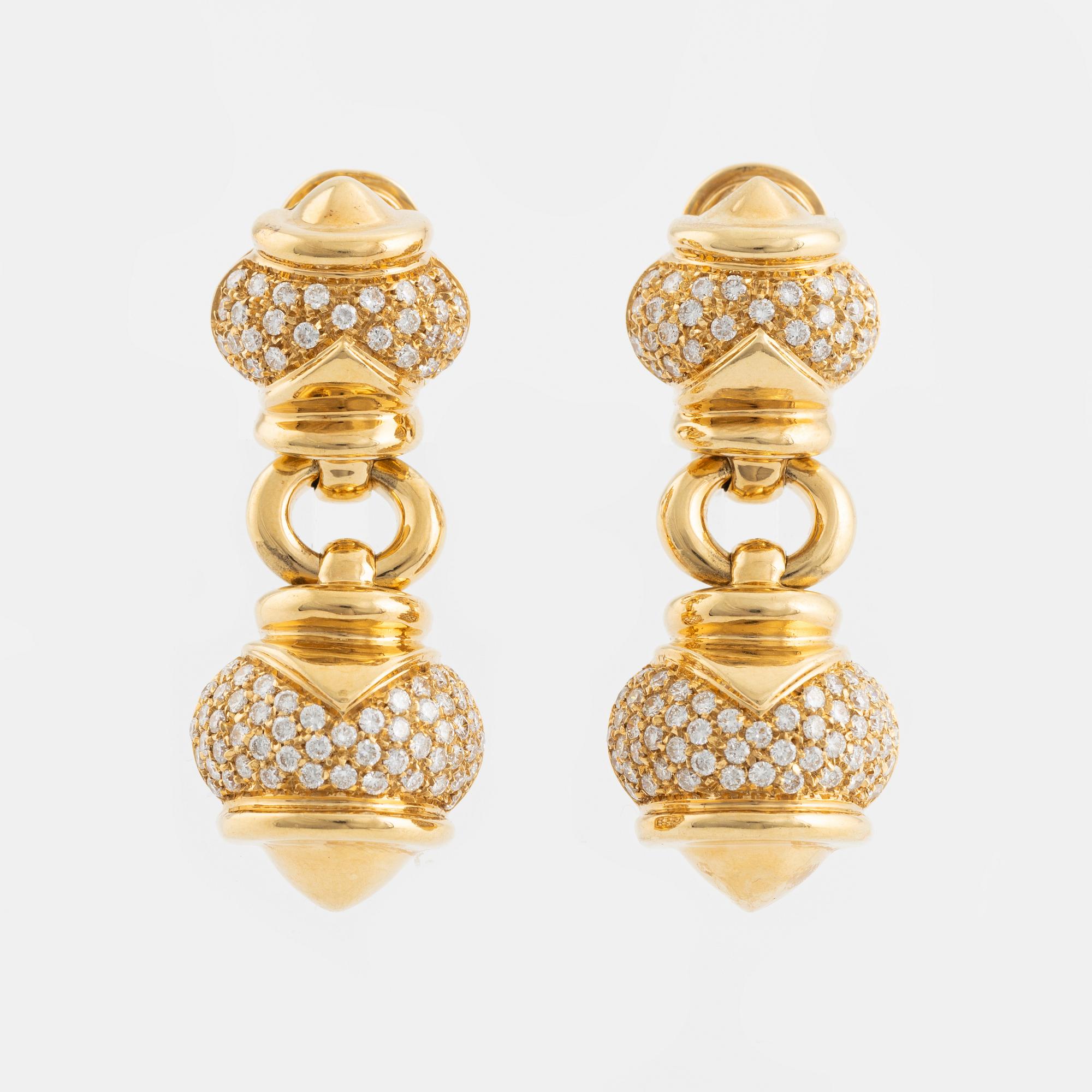 A pair of 18K gold earrings set with round brilliant-cut diamonds.