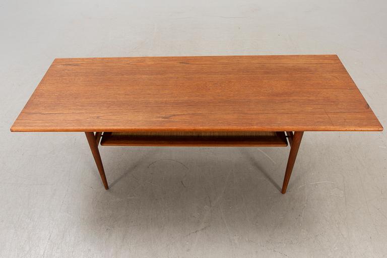 A Dansih 1960s teak and rattan  coffee table.