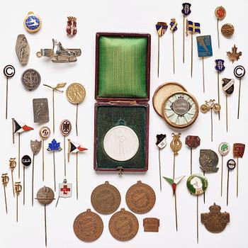 A collection of club pins/club badges for various associations/awards, including Sweden, Germany, and France.