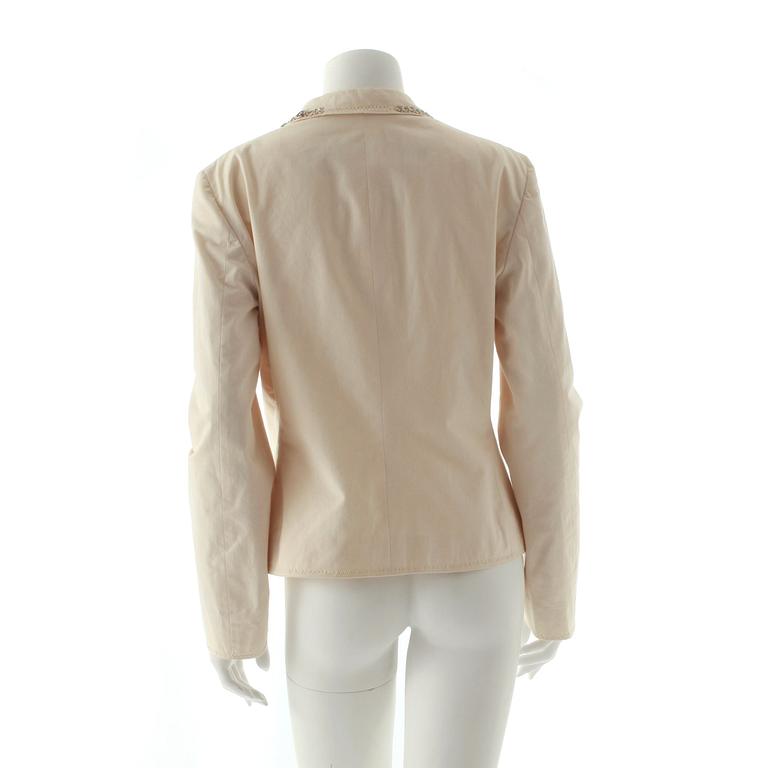 MOSCHINO cheap and chic, a creme colored cotton jacket.