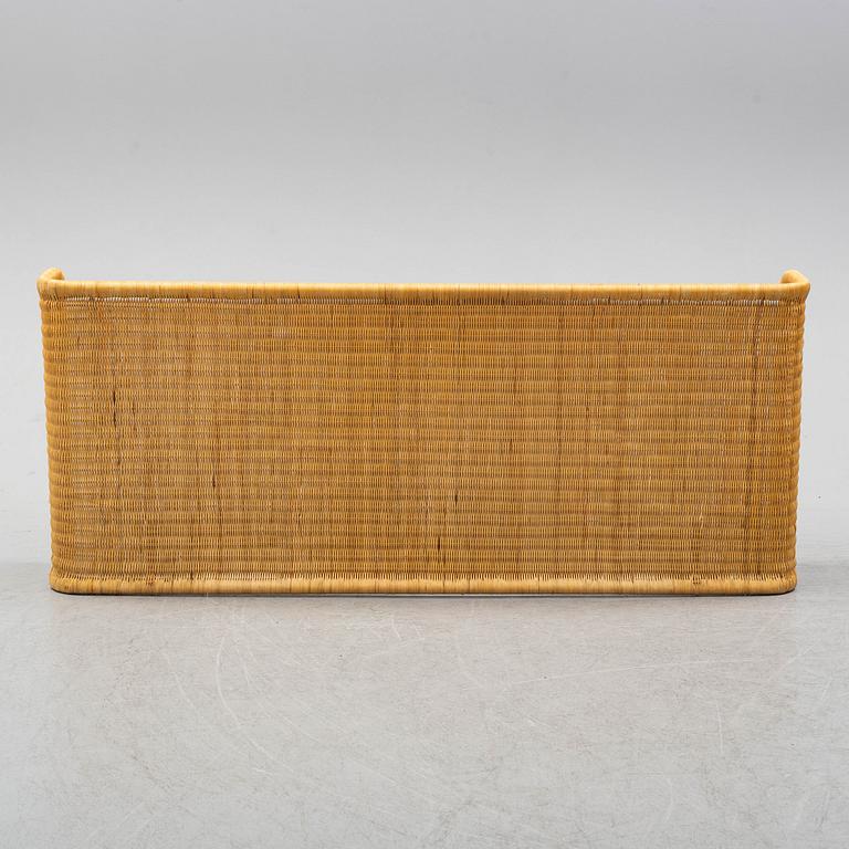 A late 20th century rattan bedside.