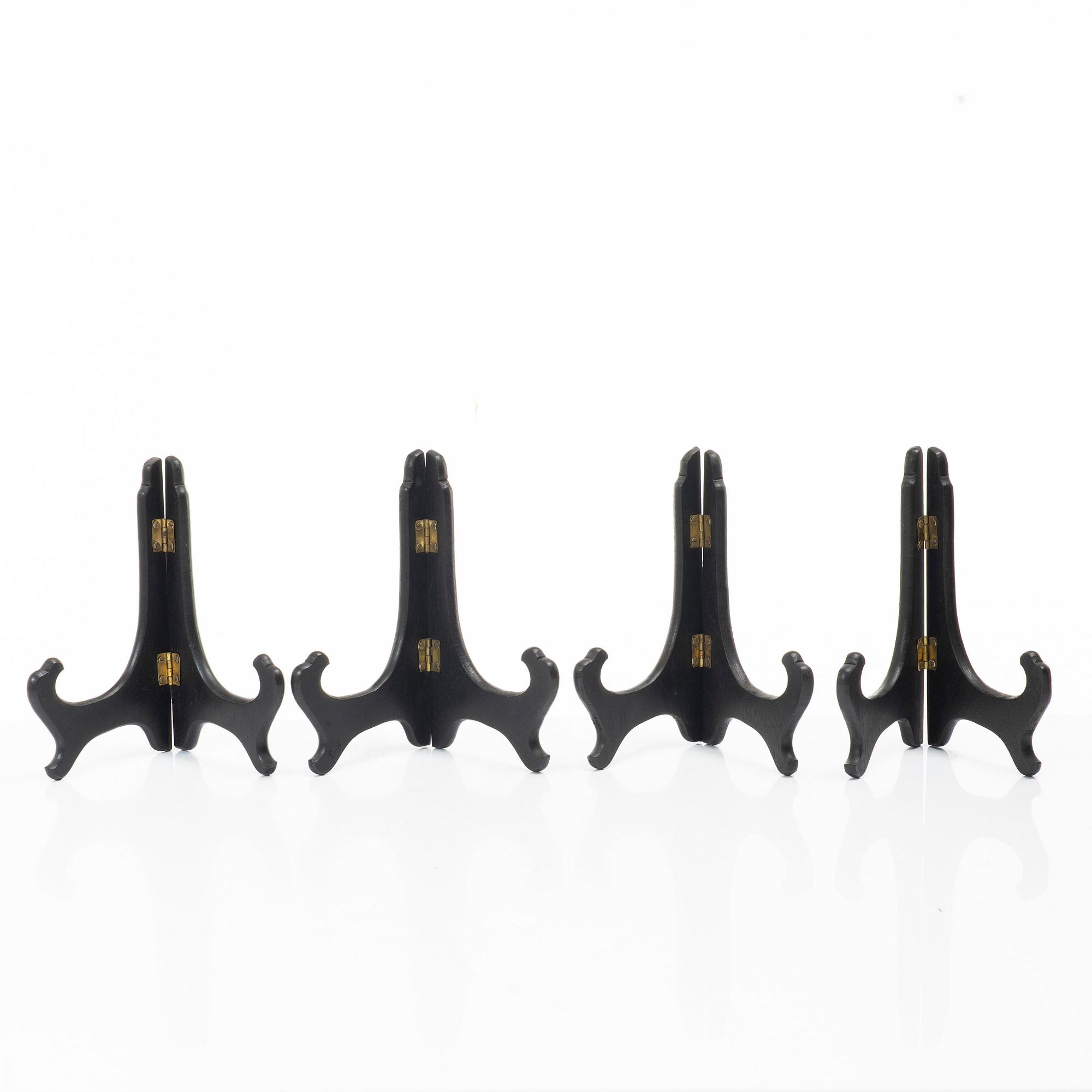 A group lot of 13 Chinese wooden stands, 20th century.