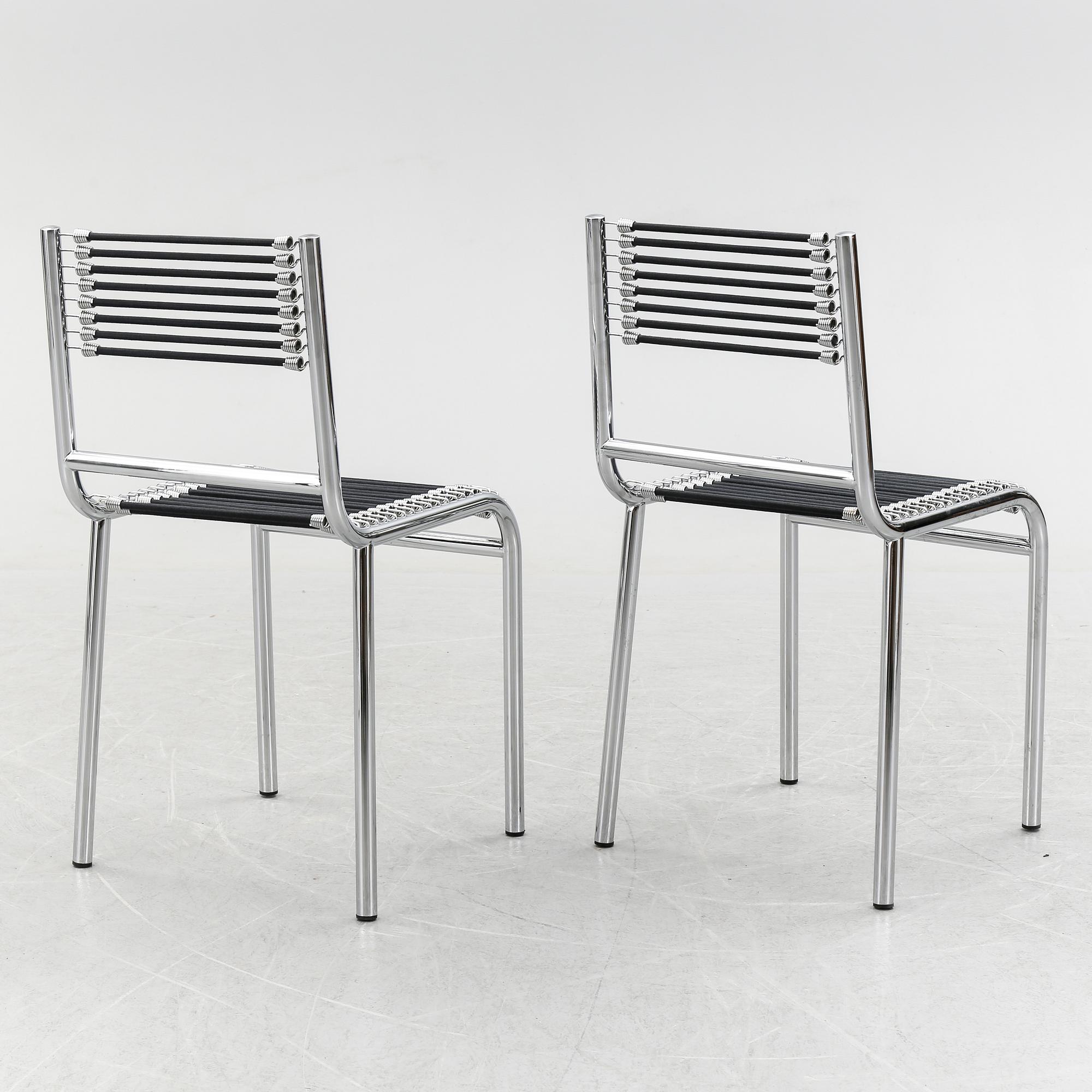 A pair of Rene Herbst chromium-plated, "Sandows" chairs, late 20th century.