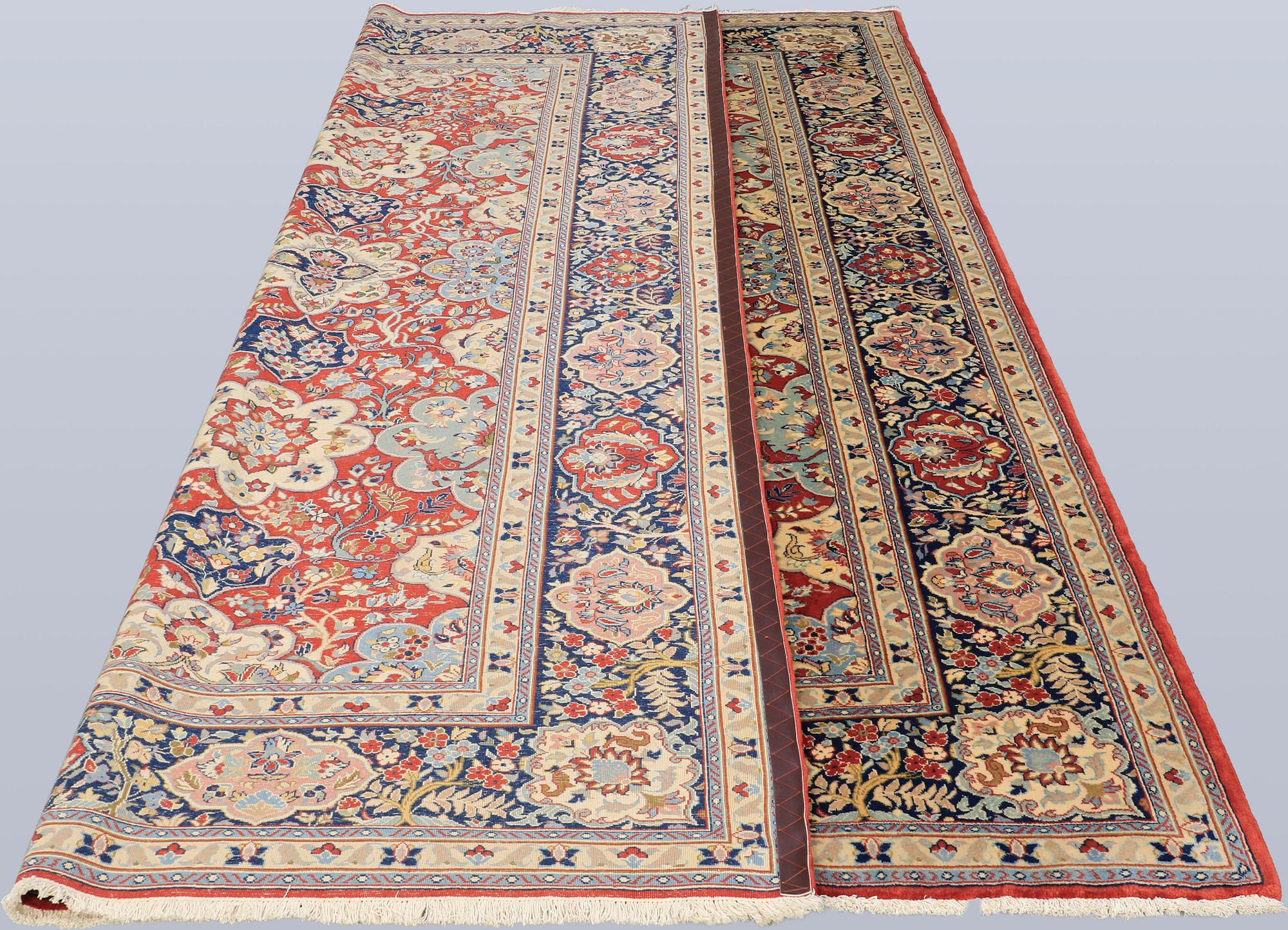 A Sarouk carpet, signed, approx. 327 x 253 cm.