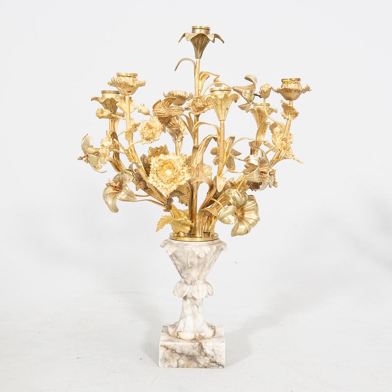 A pair of alabaster and gilded candelabras around 1900.