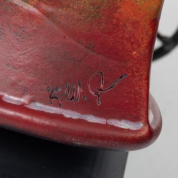 Kjell Engman, Bevingad figur i röd rock.