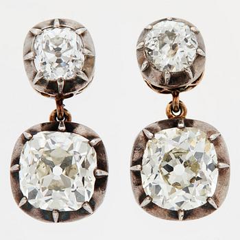 857. A PAIR OF EARRINGS set with four old-cut diamonds.