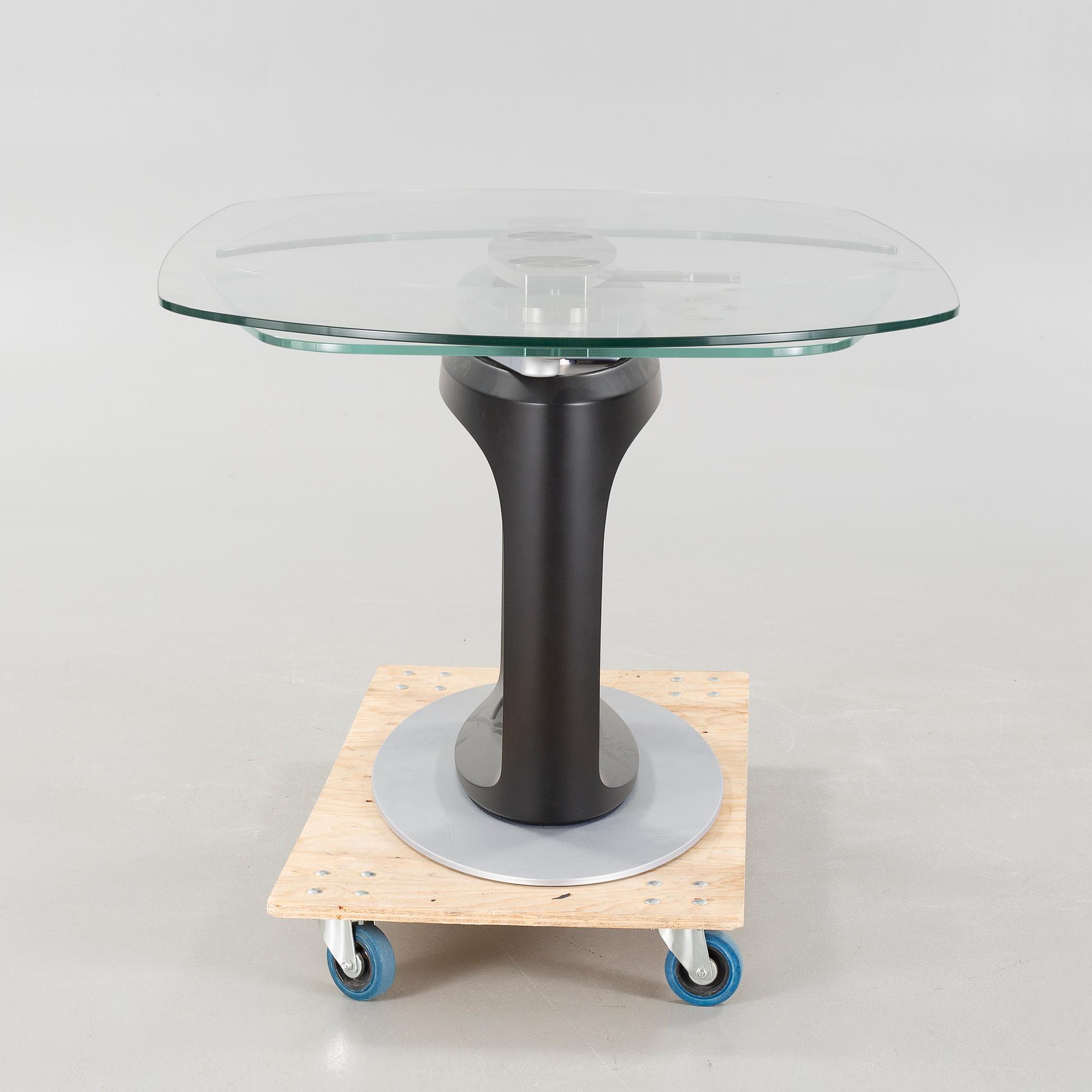 A 21st century "Orbital" dinner table by Pininfarina for Calligaris.