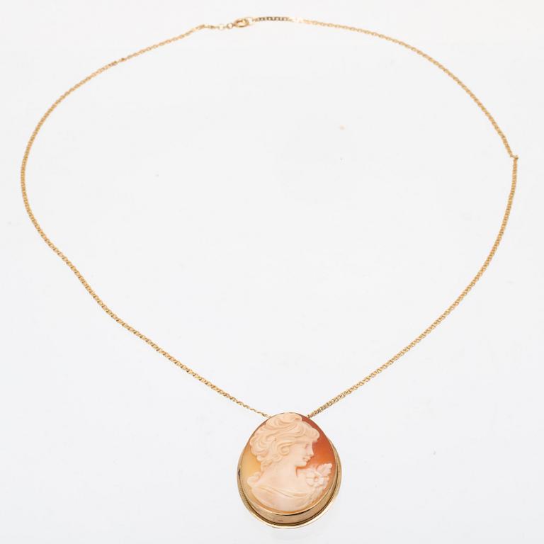 An 18K gold necklace with seashell cameo pendant 14K gold.