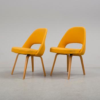 A group eight of Eero Saarinen executive side chair with wood legs, Knoll Products inc.