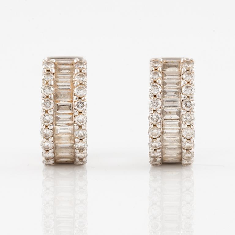 Earrings, a pair, 18K white gold set with baguette and brilliant-cut diamonds.