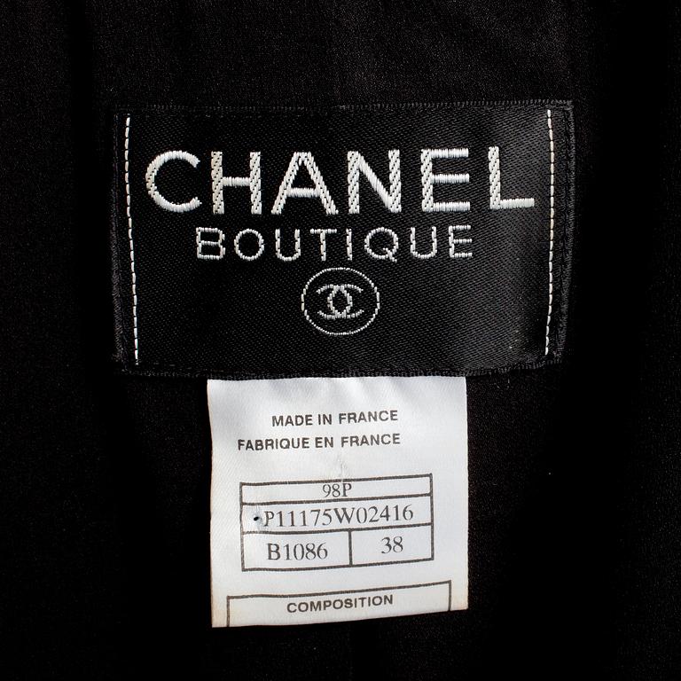 CHANEL, a two-piece suit consisting of jacket and skirt.