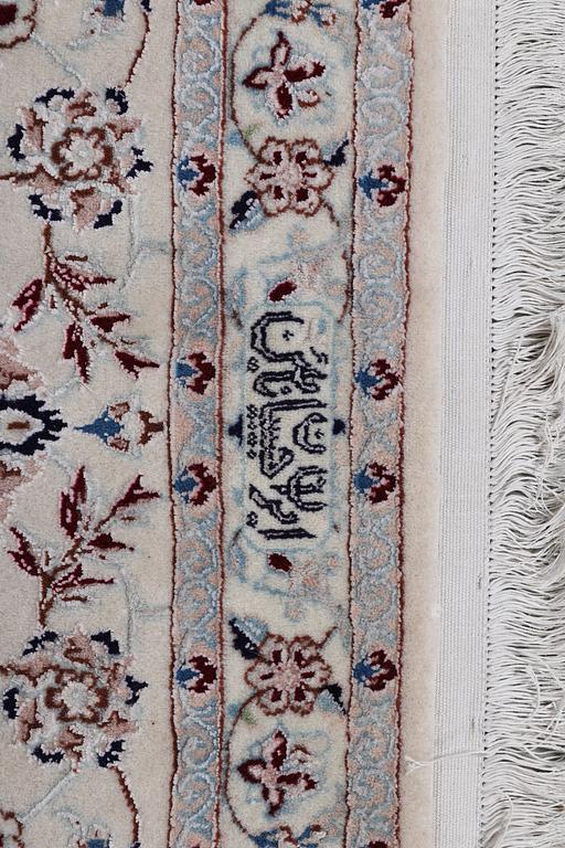 A carpet, Nain, part silk, ca 341 x 245 cm.
