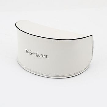 Yves Saint Laurent, a pair of grey plastic sunglasses.
