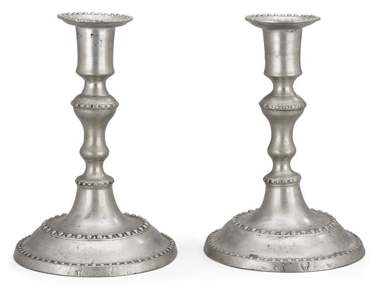 A pair of late Gustavian pewter candlesticks by C. de Flon, Växjö 1791.