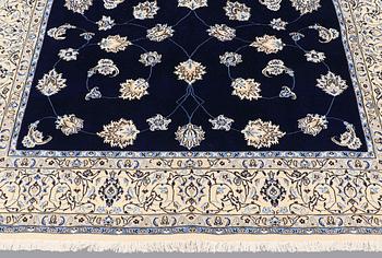 A carpet, Nain part silk s.k 9LAA, ca 312 x 199 cm.