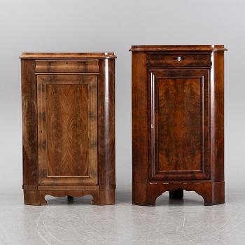 A pair of mahogany corner cabinets, mid 19th Century.