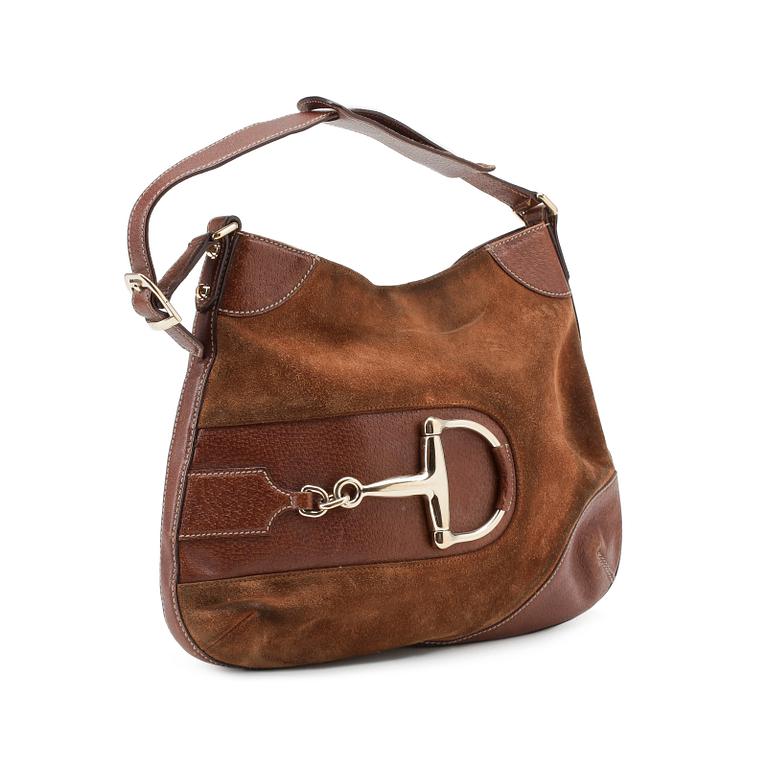 GUCCI, a brown suede shoulder bag.