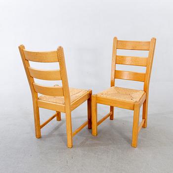 A set of four wicker and oak 1970s chairs.