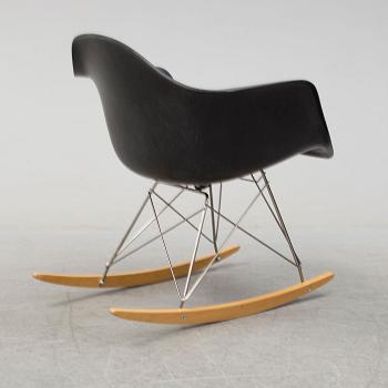 A 'Rocket chair' by Charles & Ray Eames, Herman Miller, late 20th century.