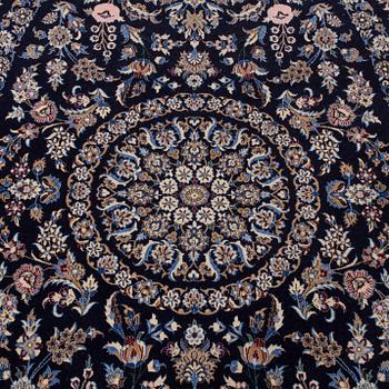 A part silk rug from Nain, around 218 x 126 cm.