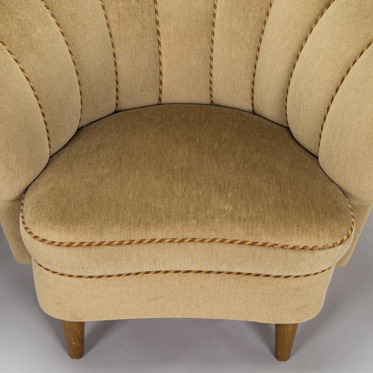 A pair of mid-20th century armchairs.