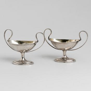 A pair of firt half of the 19th century parcel-gilt silver salt-cellars by an uknown master, one marked HB.
