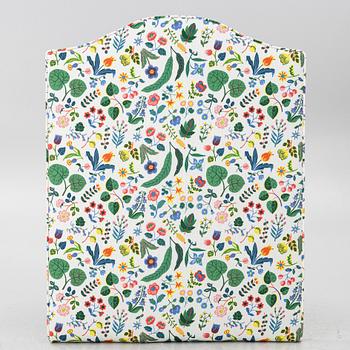 Headboard, upholstered in fabric from Svenskt Tenn.