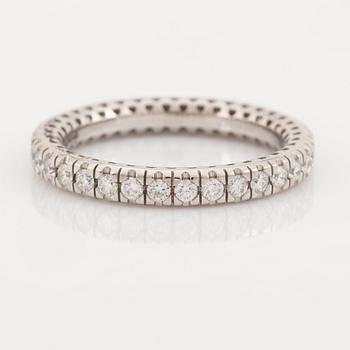 Brilliant cut diamond eternity ring.