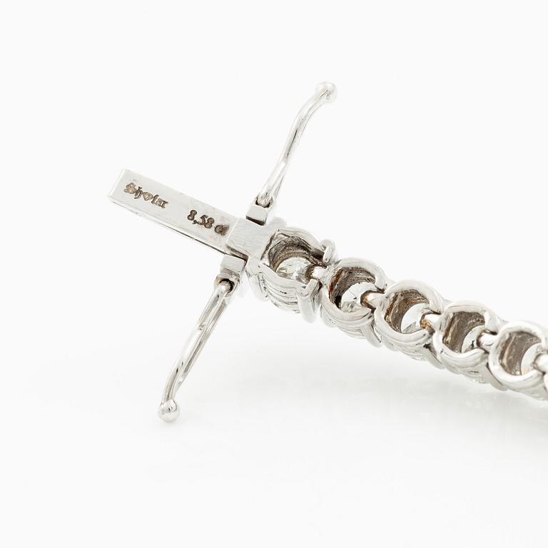 Tennis bracelet 18K white gold with brilliant-cut diamonds.