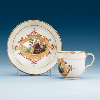 719. A Meissen cup with saucer.