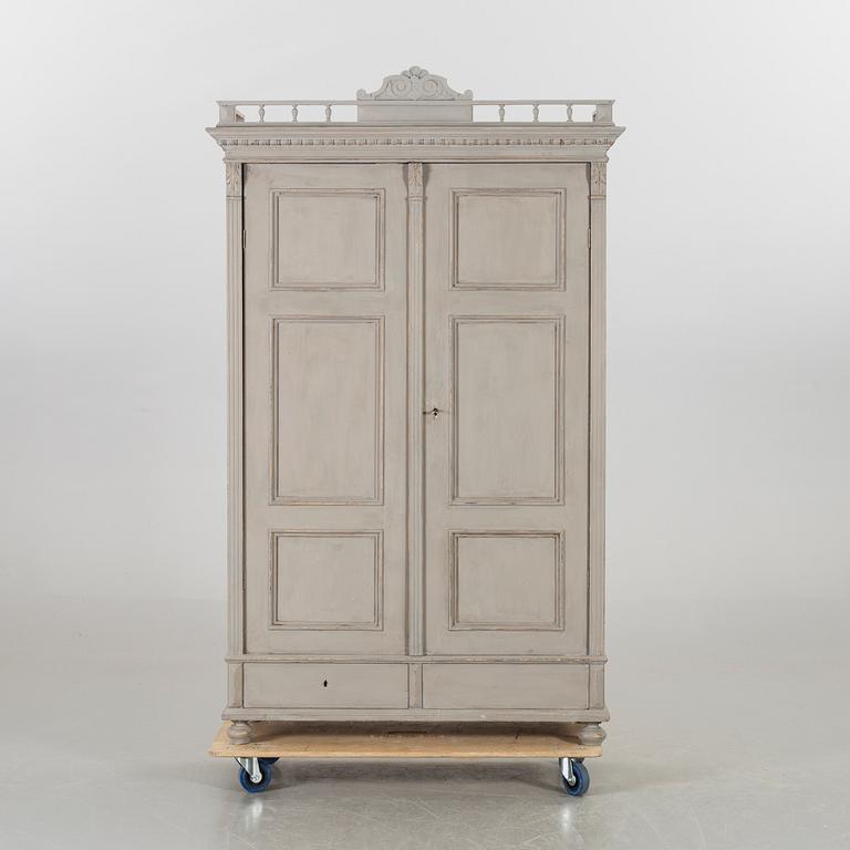 A pianted wooden Neo Renaissance wardrobe around 1900.