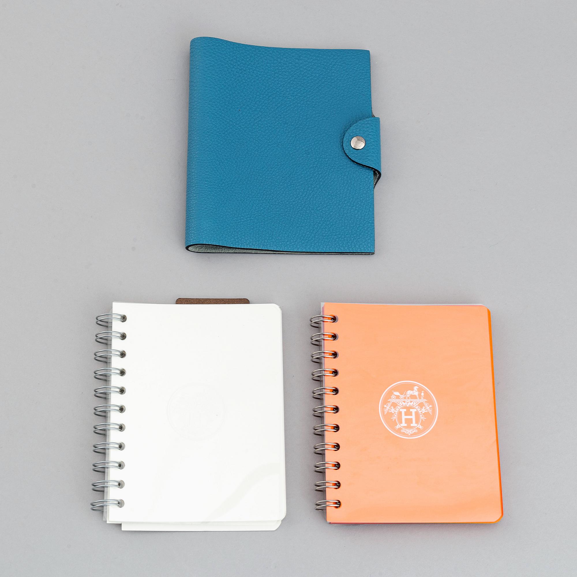 Hermès, a blue leather notebook with two scripple pads.