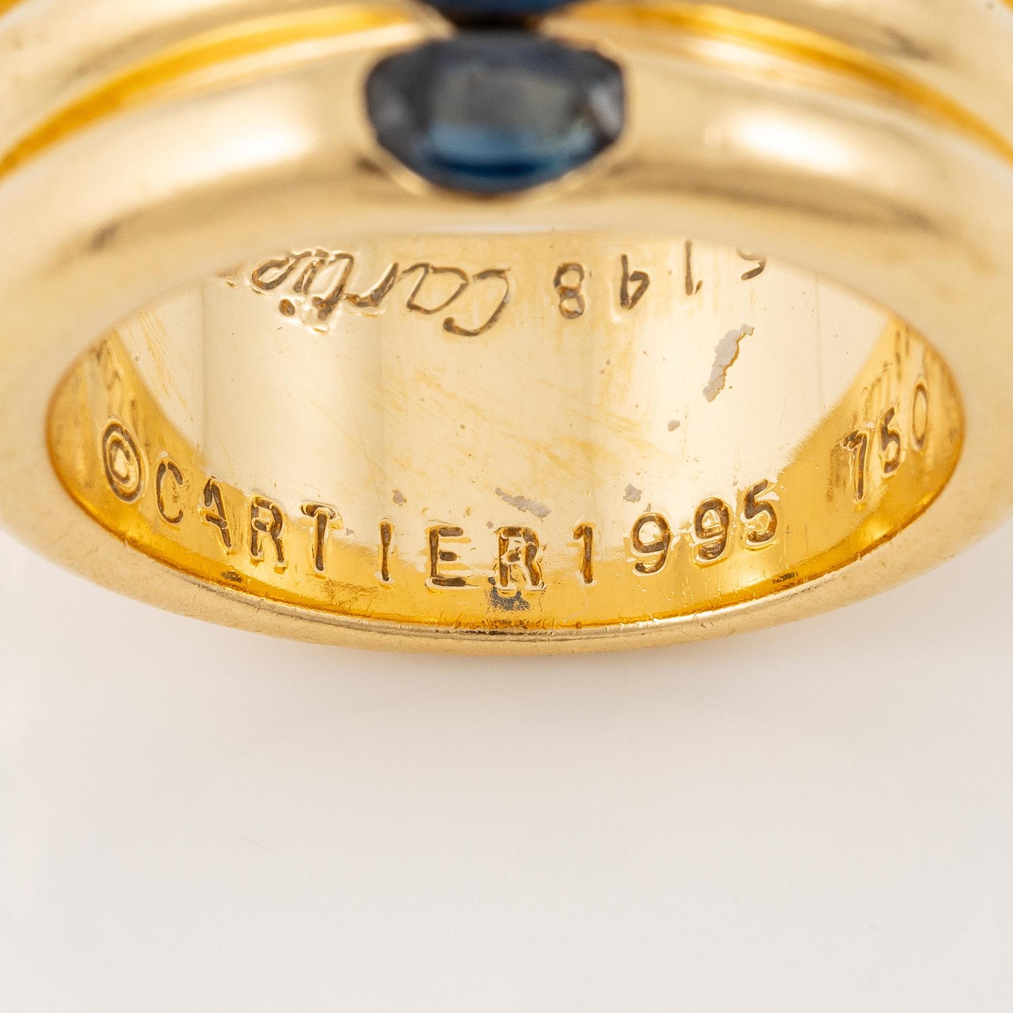 A Cartier ring "Ellipse" 18K gold with faceted sapphires.