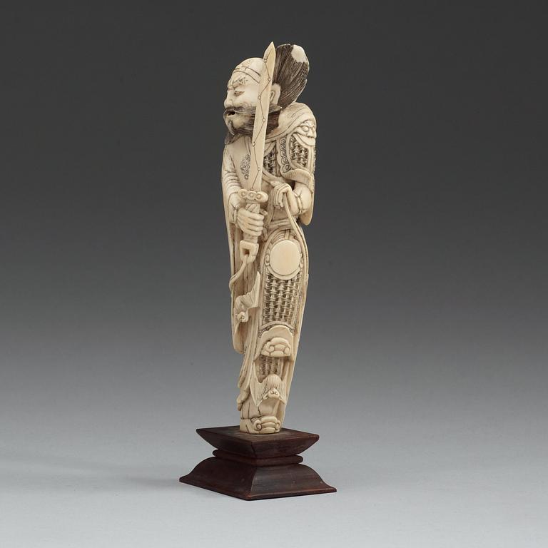 An carved ivory sculpture of a guardsman, China, early 20th Century.