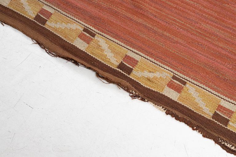 A flat weave carpet, c. 360 x 265 cm.