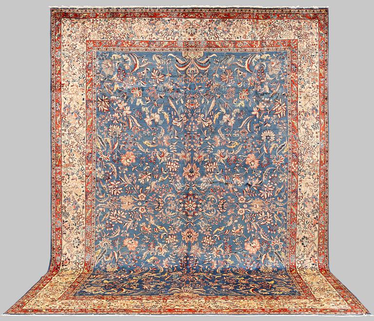 A figural Sarouk carpet, approx. 412 x 300 cm.