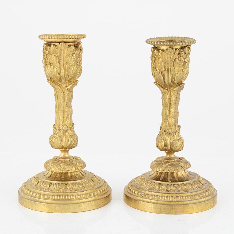 A pair of ormolu candlesticks, late 19th Century.