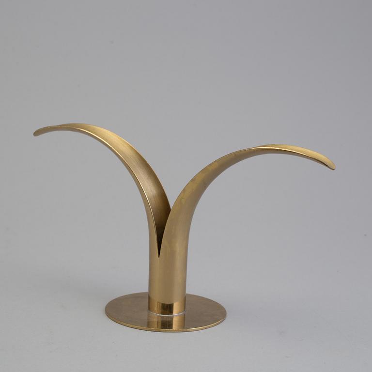 4 different candlesticks, including Ystad Metall, "Nagel" by Werner Stoff.