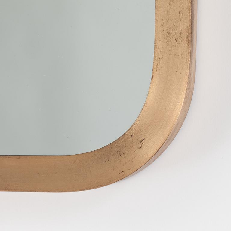 A brass mirror, possibly by Josef Frank for Svenskt Tenn.