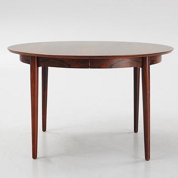 Niles Otto Møller, a rosewood veneered table with four chairs, JL Møller, Denmark, 1950's/60's.
