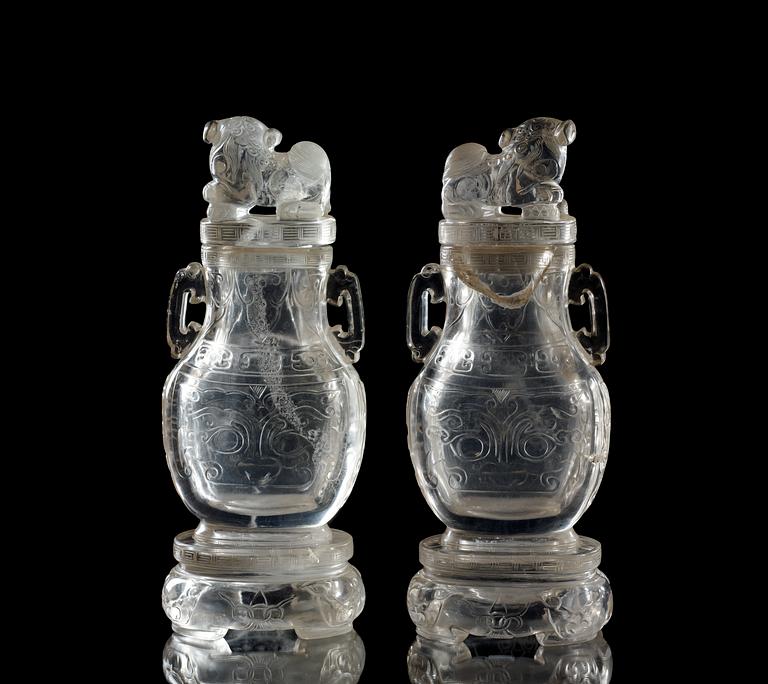A pair of rock chrystal vases with covers, Qing dynasty.