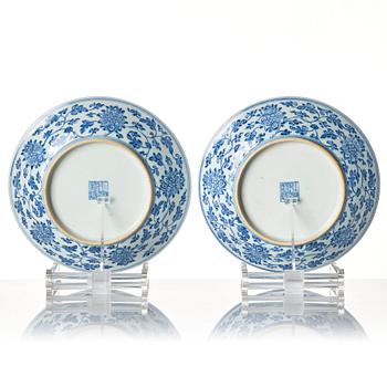A pair of blue and white lotus dishes, Qing dynasty, Qianlong seal mark and of the period (1736-95).