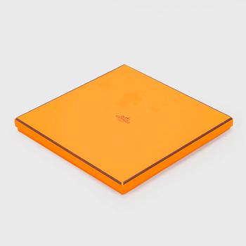 Hermès, a 'Les Voitures à Transformation' silk scarf.
