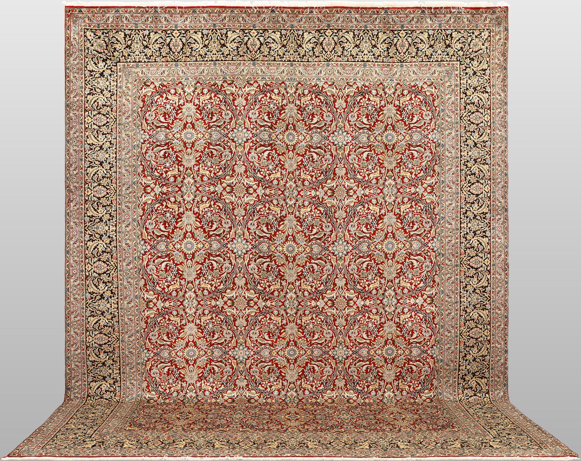 A Kirman lavar carpet, 403 x 304 cm.