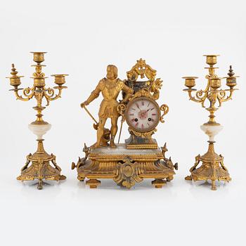 A mantel clock and a pair of candelabra, P.H. Mourey, France, late 19th Century.