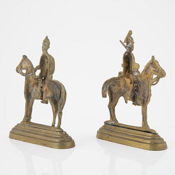 A pair of brass book stands,